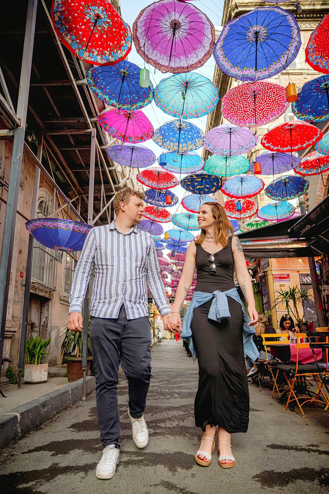 Couple walking at the vibrant Karaköy Street