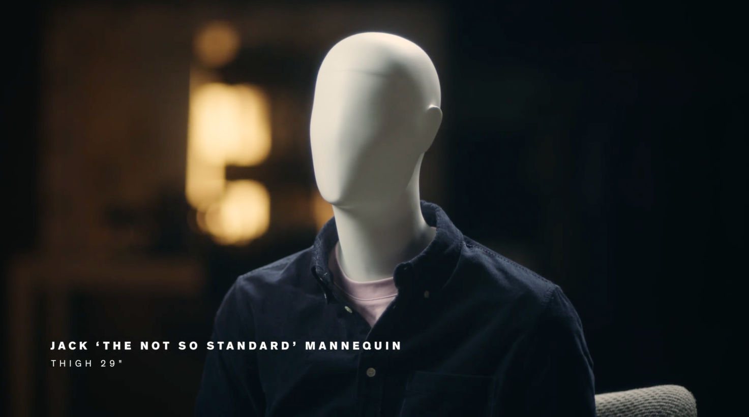 A white mannequin wearing a blue shirt Description automatically generated