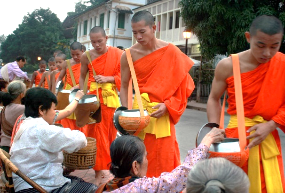 A group of people in orange robes

Description automatically generated