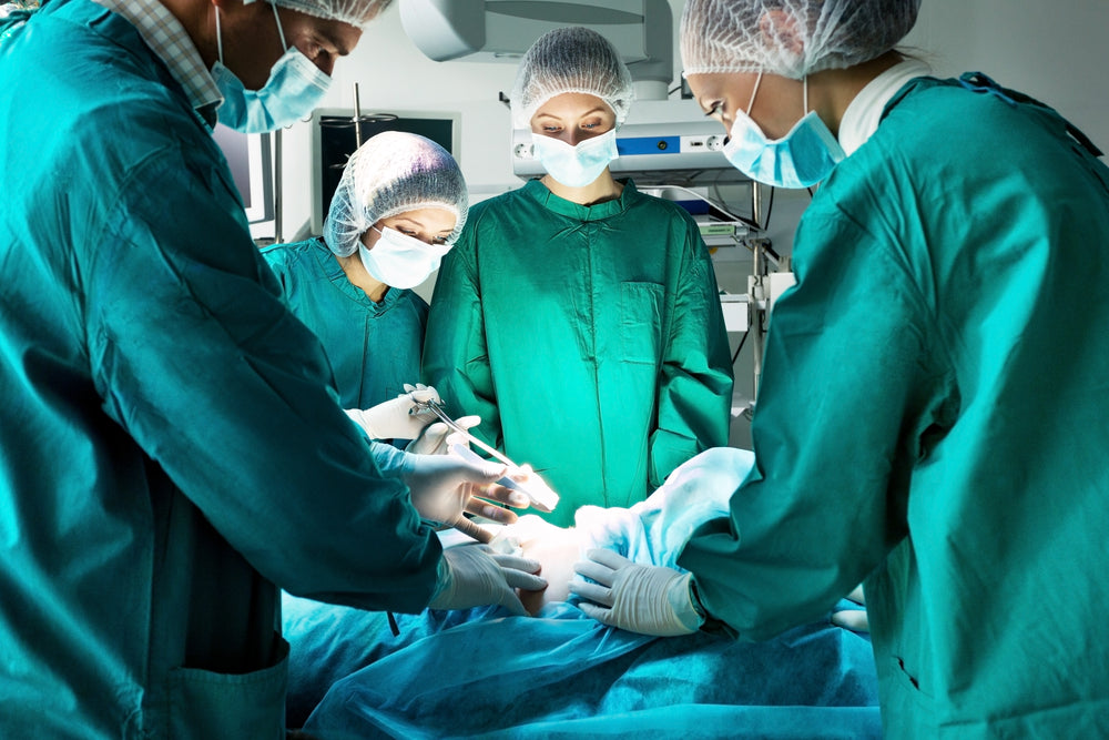 doctors performing shoulder surgery