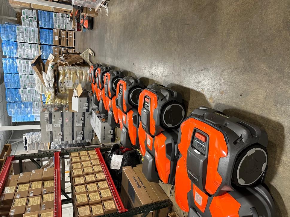 A warehouse with several orange and black machines  AI-generated content may be incorrect.