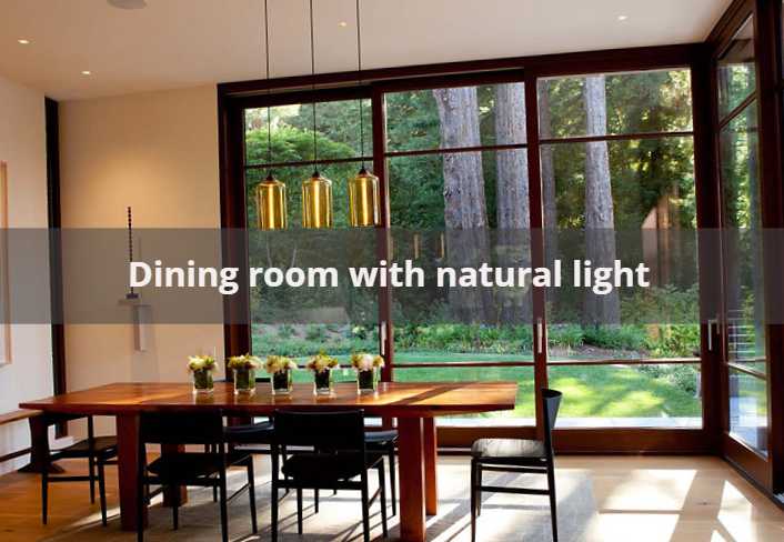 A dining room with the natural light through window