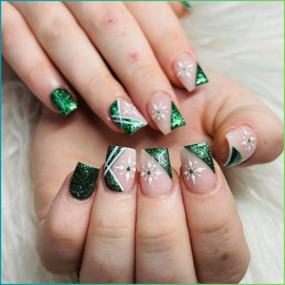 Close up of hands with Christmas Green Nails having  Green French Tips with Snowflakes