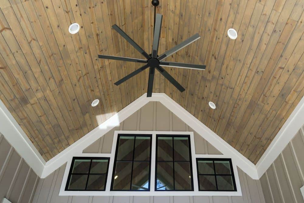 A closer look at the back porch's cathedral ceiling clad in wood planks.