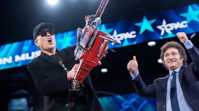 Trump’s DOGE head Musk wields blinged out chainsaw at CPAC, a gift from  Argentina’s Milei