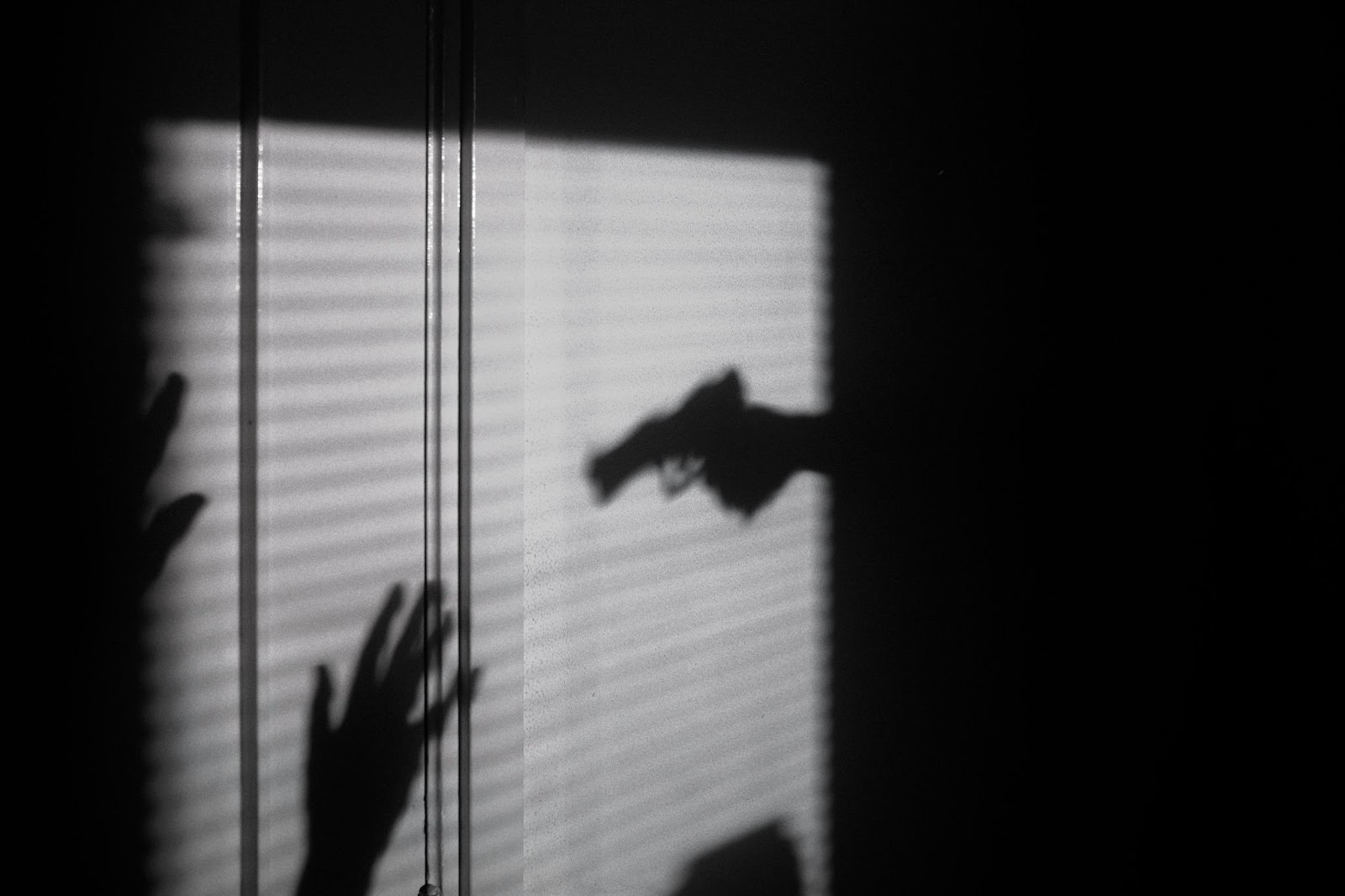 A home invader holding a gun