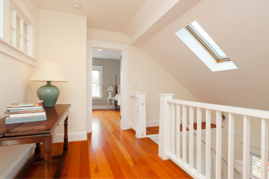 is it worth it pros and cons of a second story home addition upstairs hallway with table and skylight custom built michigan