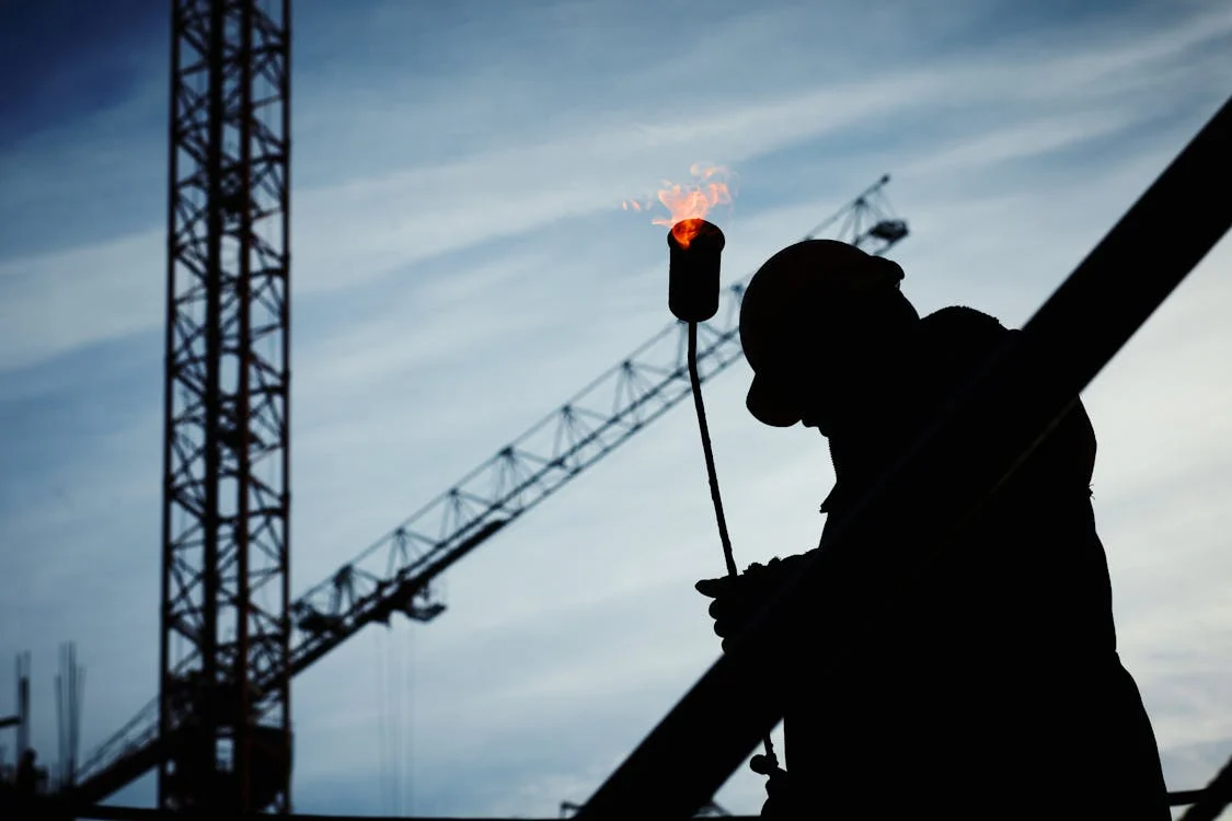 Worker managing risk on site using proactive incident management practices.