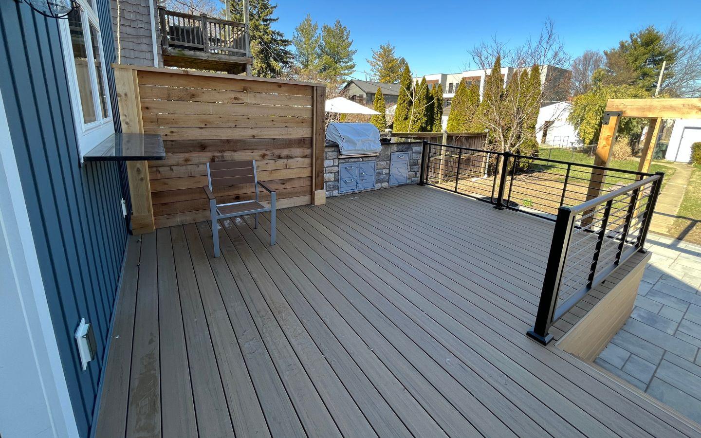 A deck with a fence and a chair

AI-generated content may be incorrect.