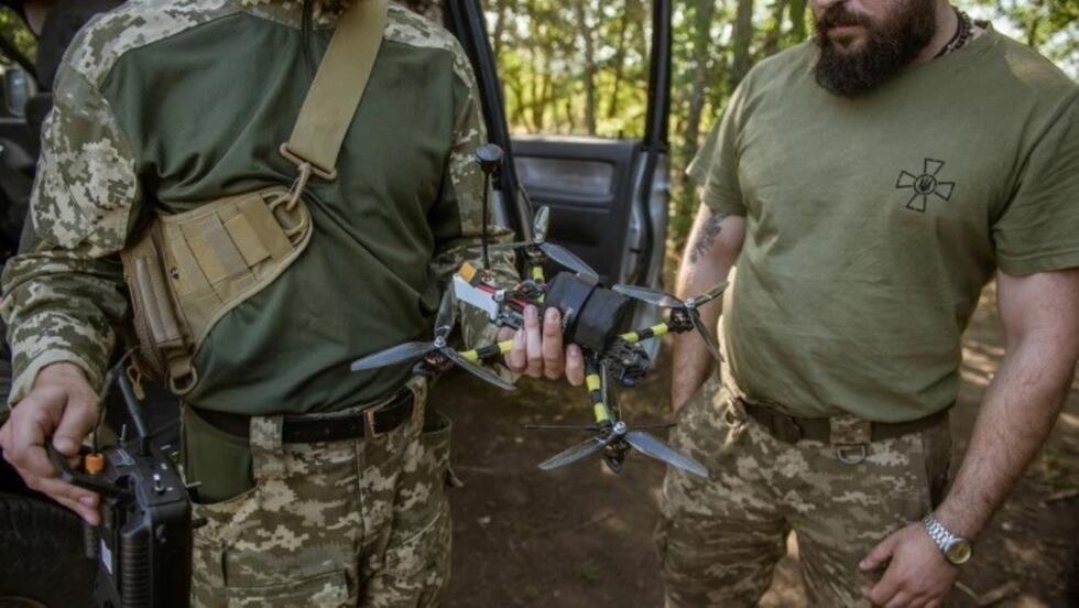 Ukrainian soldiers with a drone. The technology’s use has helped transform military tactics.
