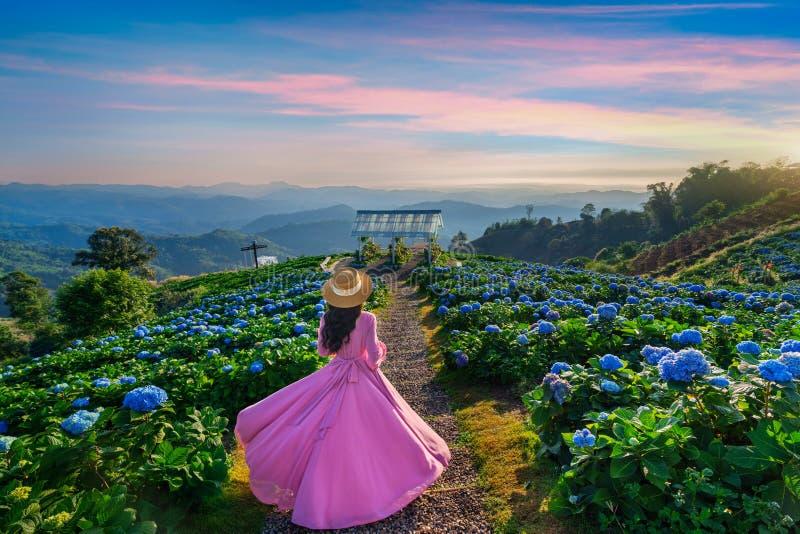 Beautiful Girl Enjoying Blooming Blue Hydrangeas Flowers in Garden ...