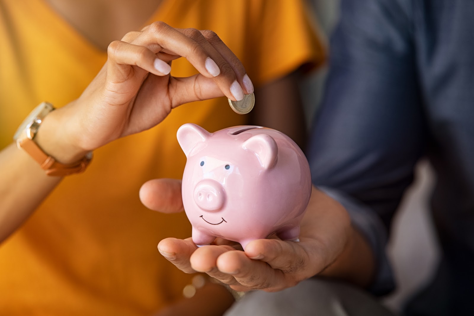 Woman holding a piggy bank