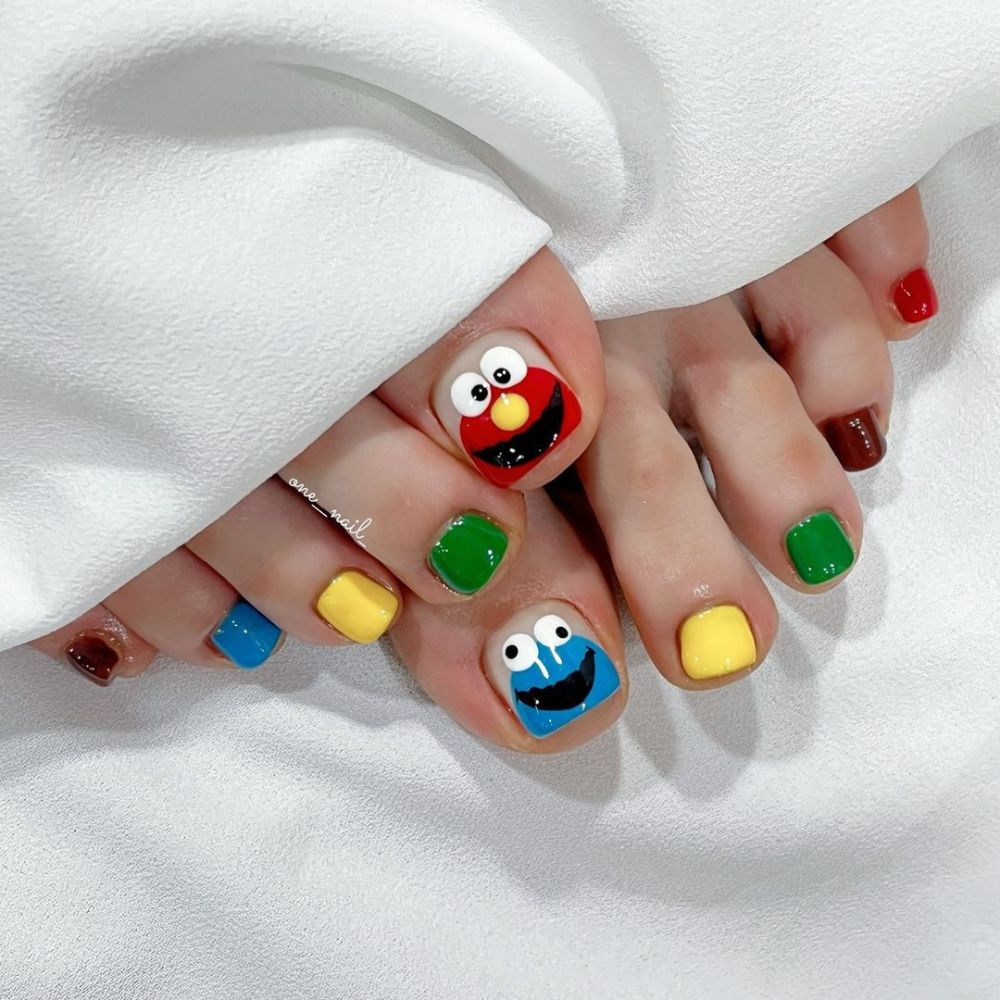 Close up of foot with radiant toe nail having Sesame Street Theme