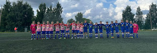 A group of football players on a field Description automatically generated