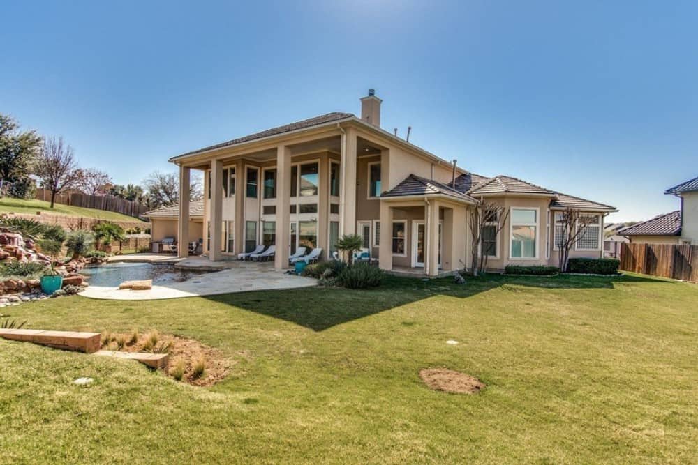 Rear exterior view showing the expansive lanai and pool deck.