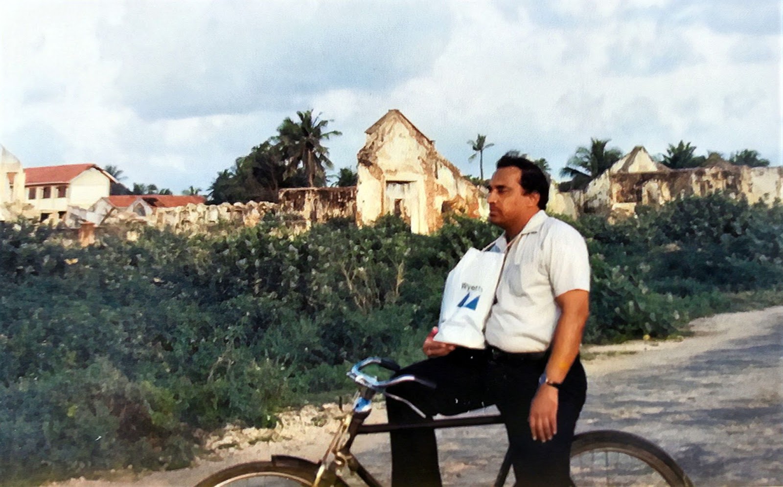 Dr.Gamini Cycling in the deserted city of Jaffna amidst visible scars of war
