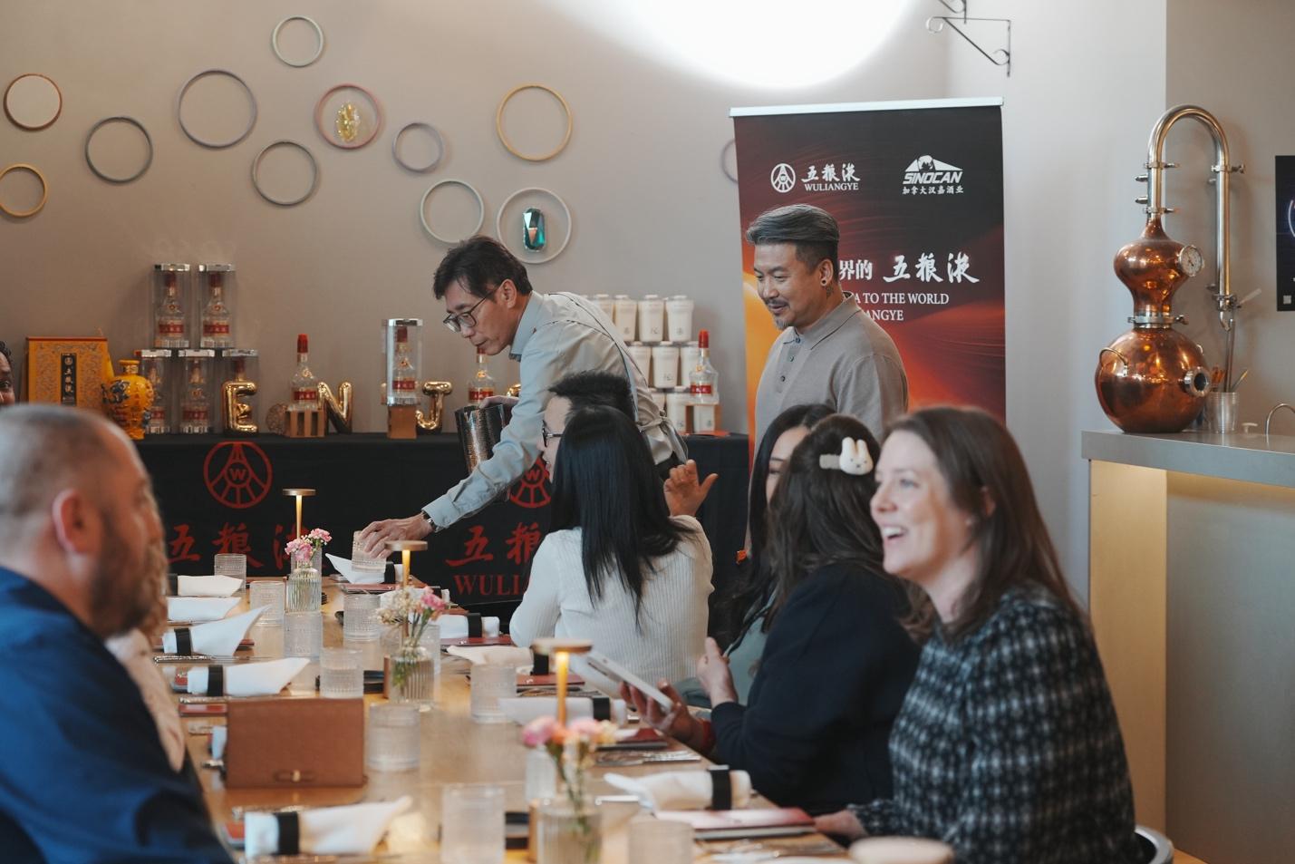 A group of people sitting at a table

AI-generated content may be incorrect.