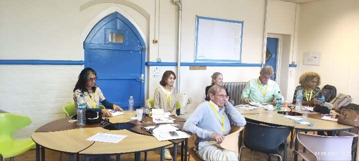 A group of people sitting at a tableDescription automatically generated