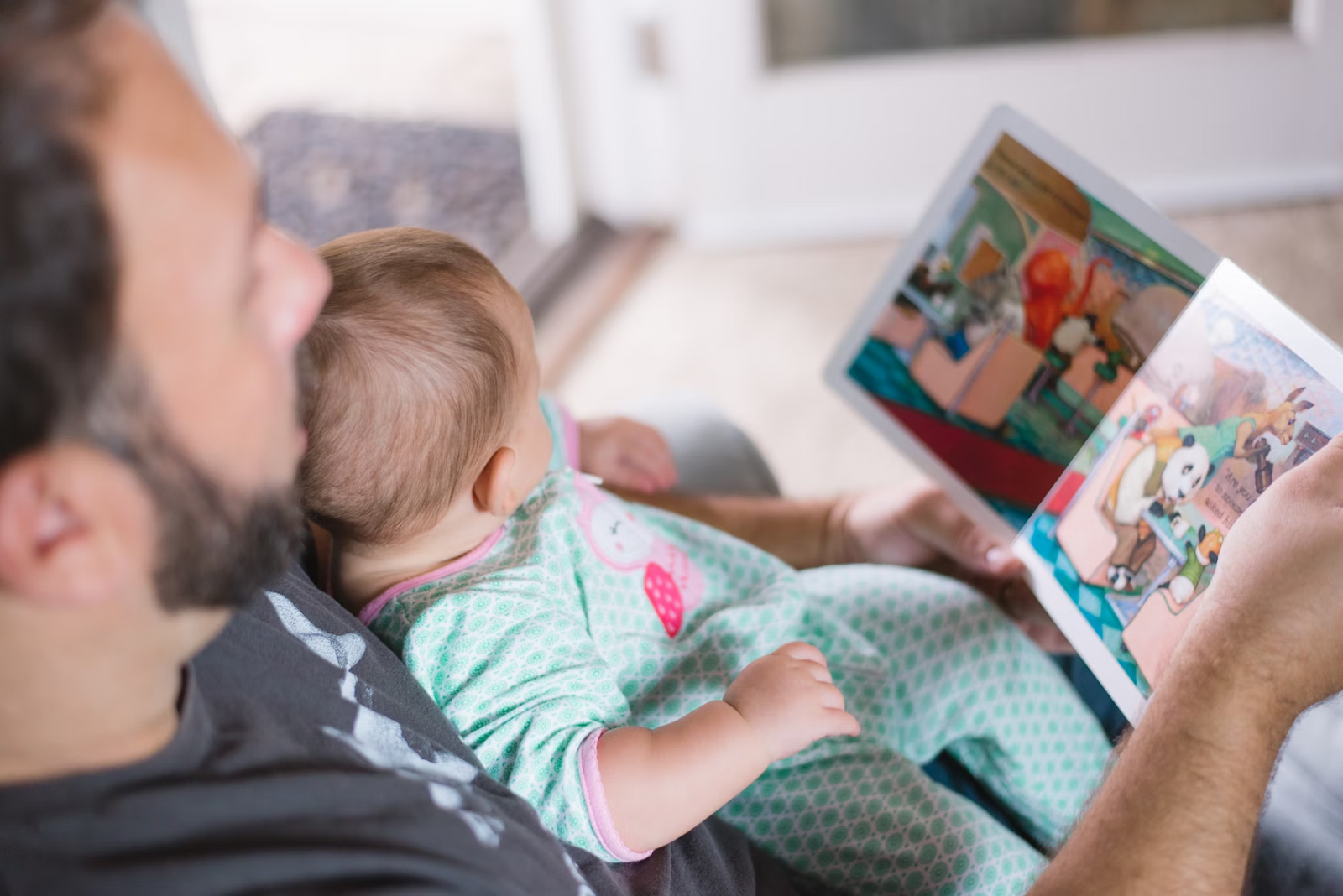 Dad and baby reading a book