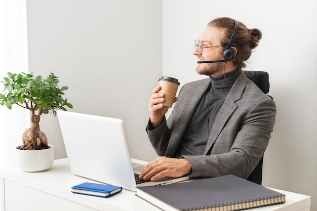 Medium shot smiley man at desk