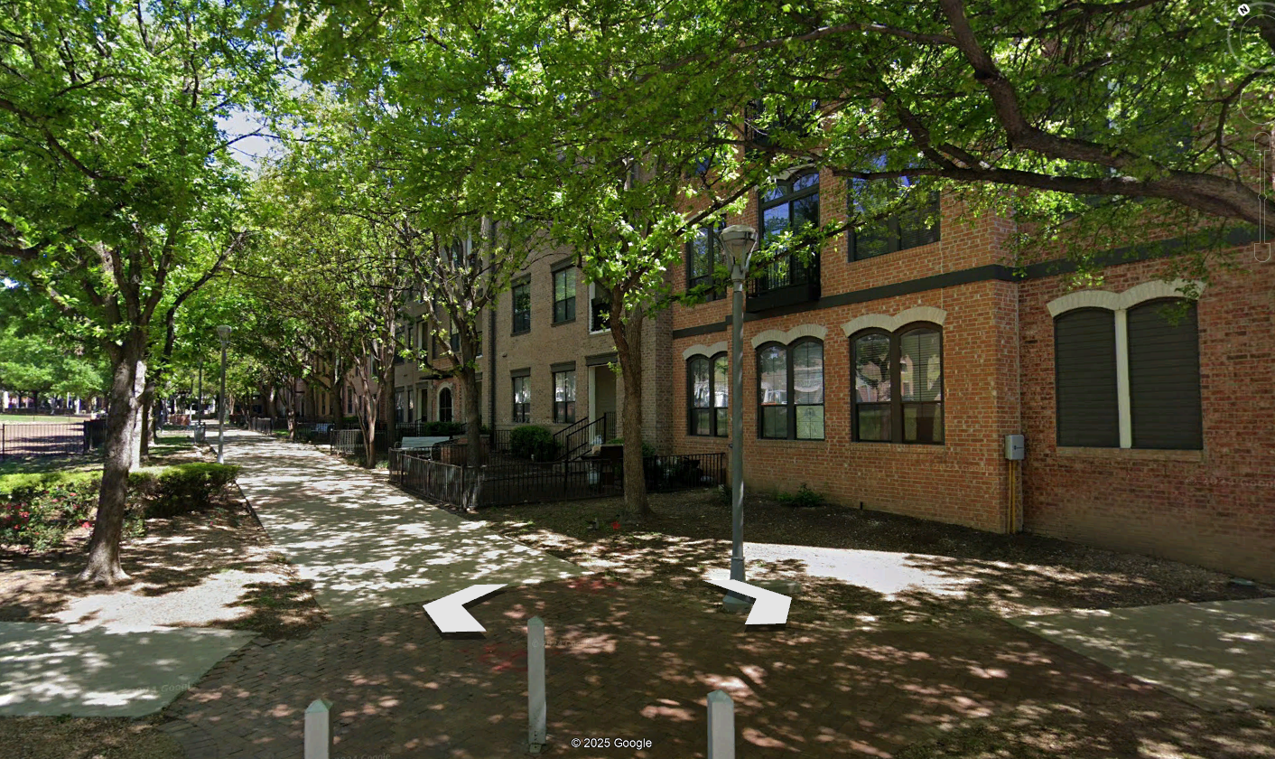 A street with trees and buildings

Description automatically generated