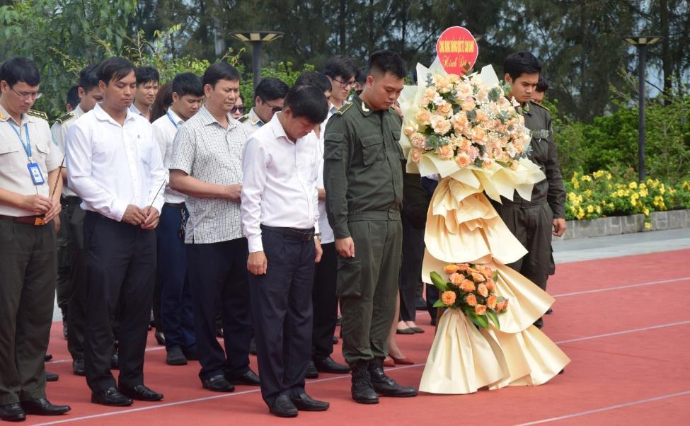 A group of people standing on a trackDescription automatically generated