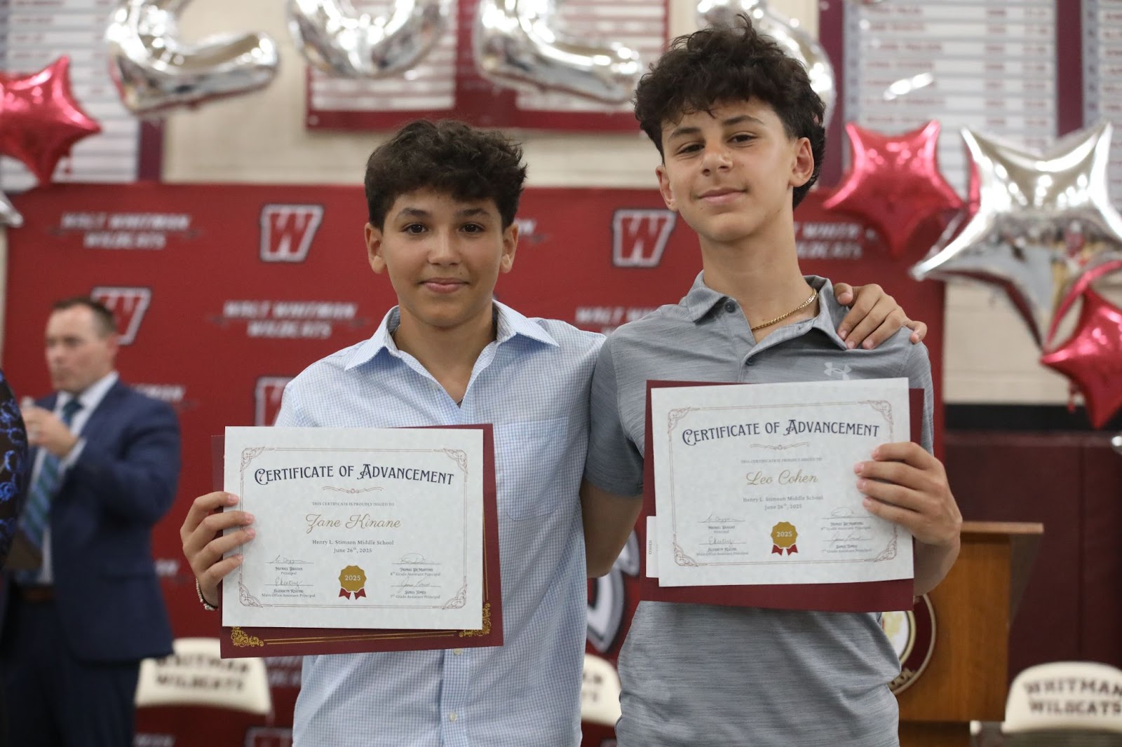 8th graders holding certificates 