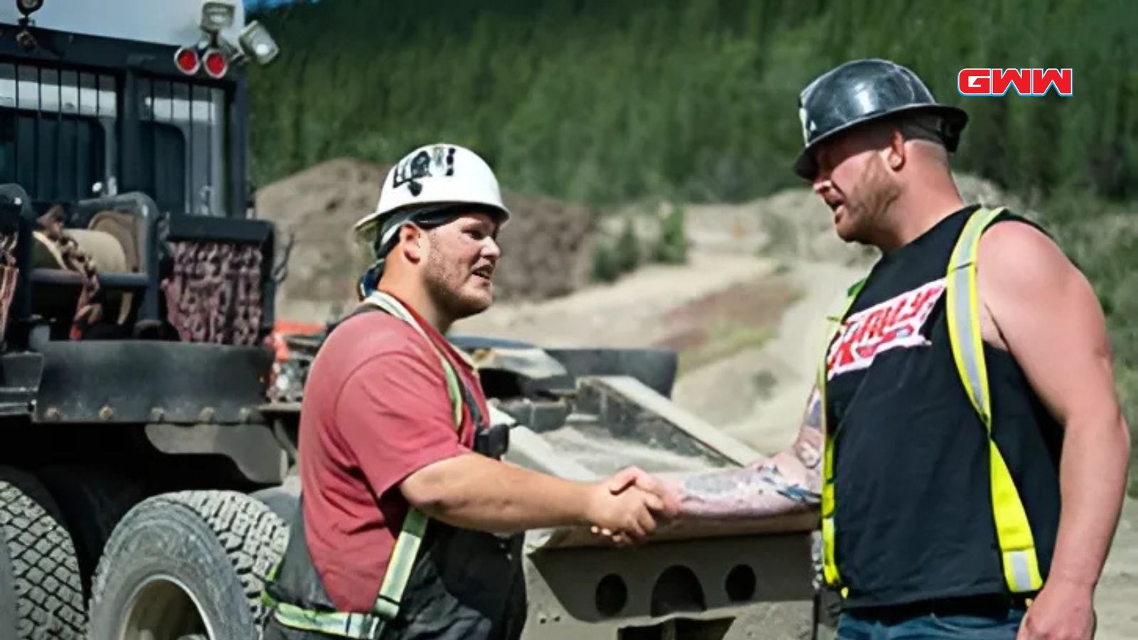 Two Gold Rush miners, Rick Ness and Parker Schnabel, shake hands at a mine