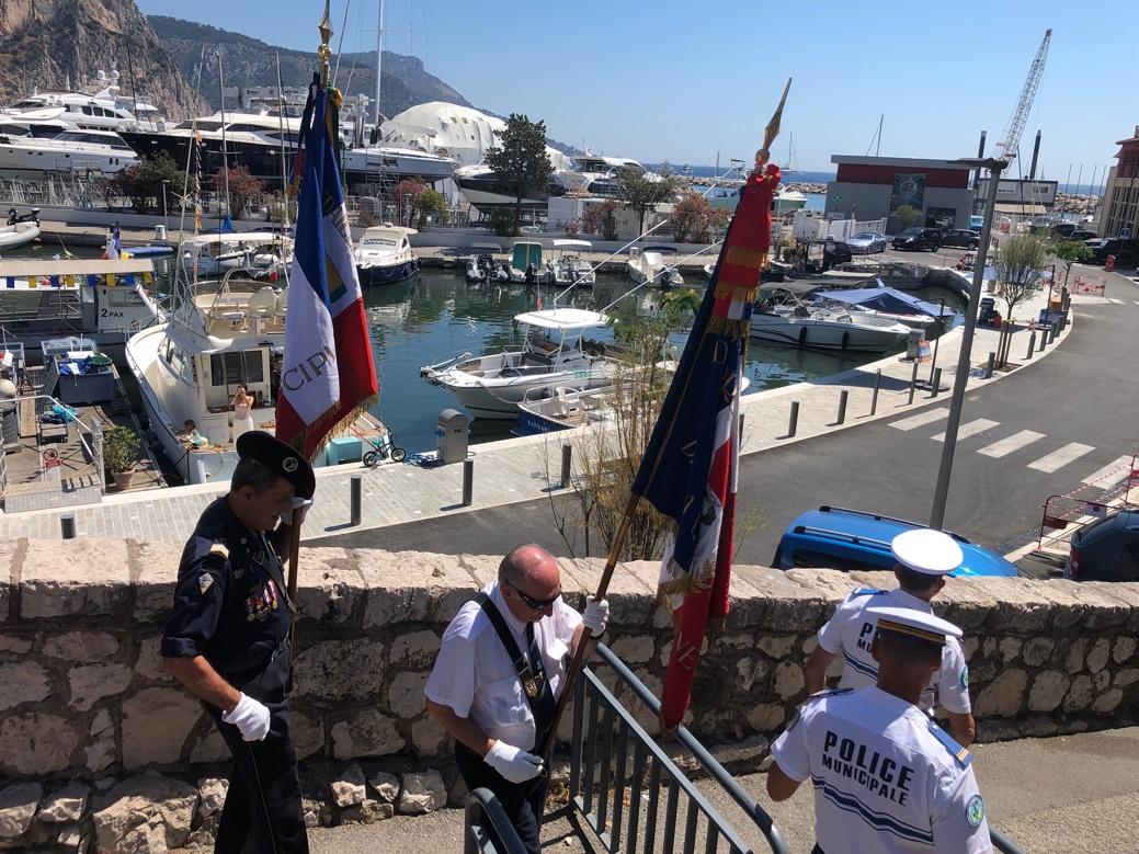 A group of police officers holding flags

Description automatically generated
