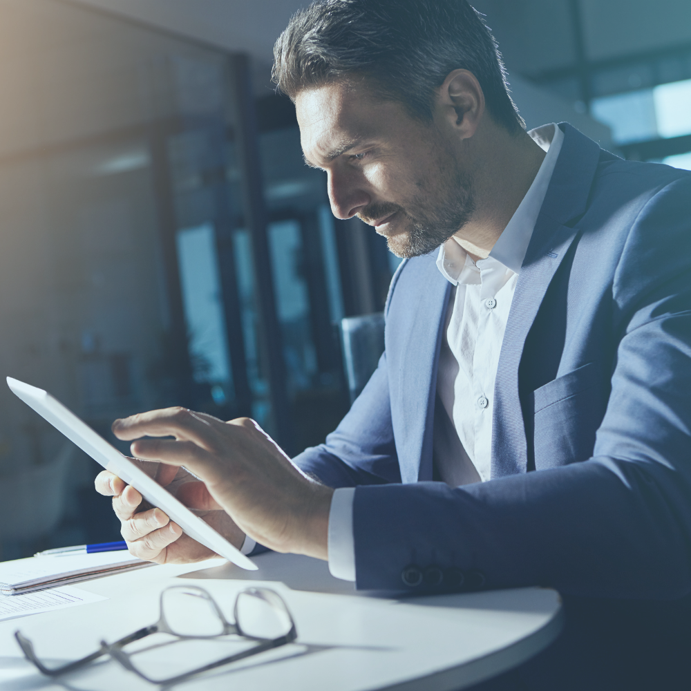 man working on ipad