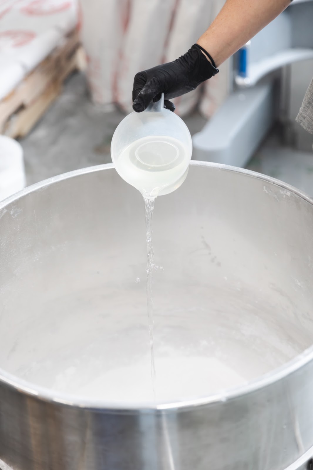 Old Whaling Co. production manager Cam adding fragrance to the mixture