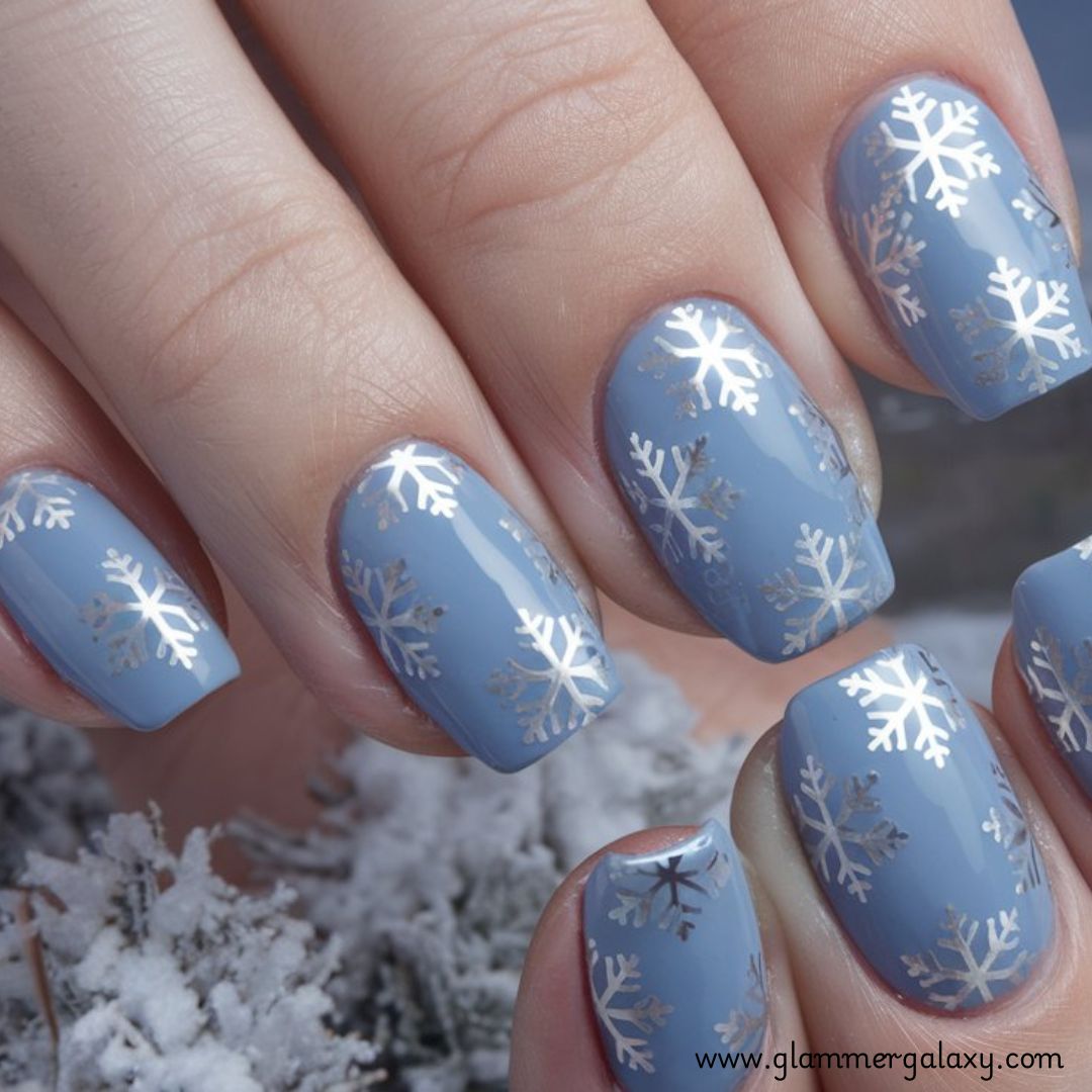 Snowflake Nails having Soft Blue Nails with Silver Snowflakes
