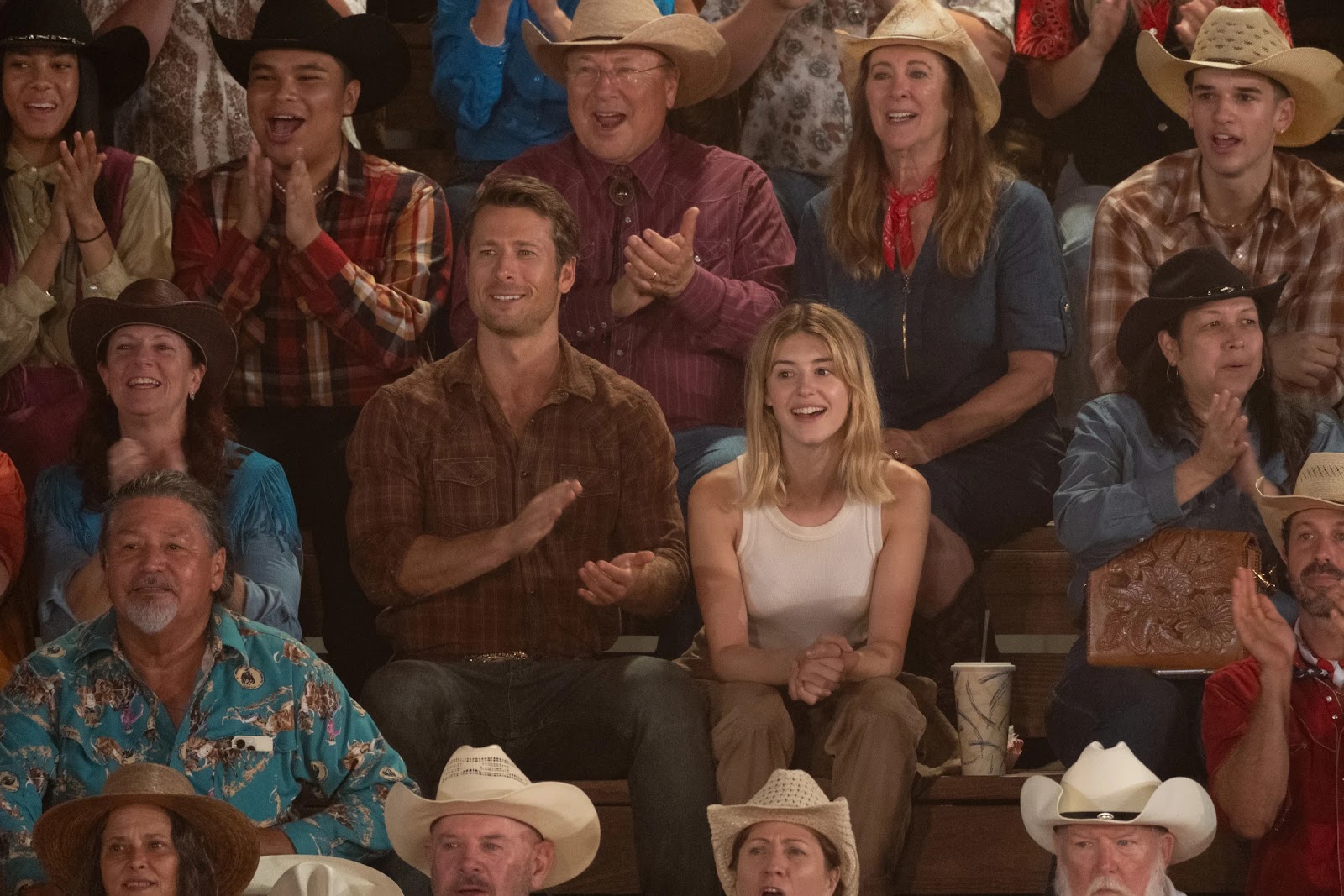 Glen Powell’s parents appear behind him and Daisy Edgar-Jones in <em>Twisters</em>.