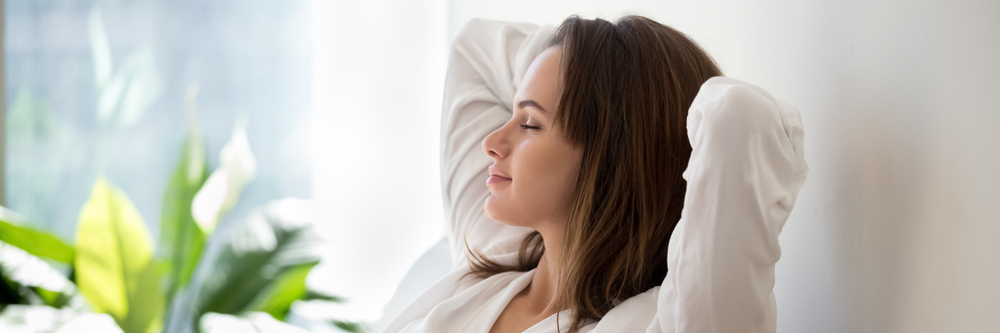 Woman closing eyes and relaxing. 