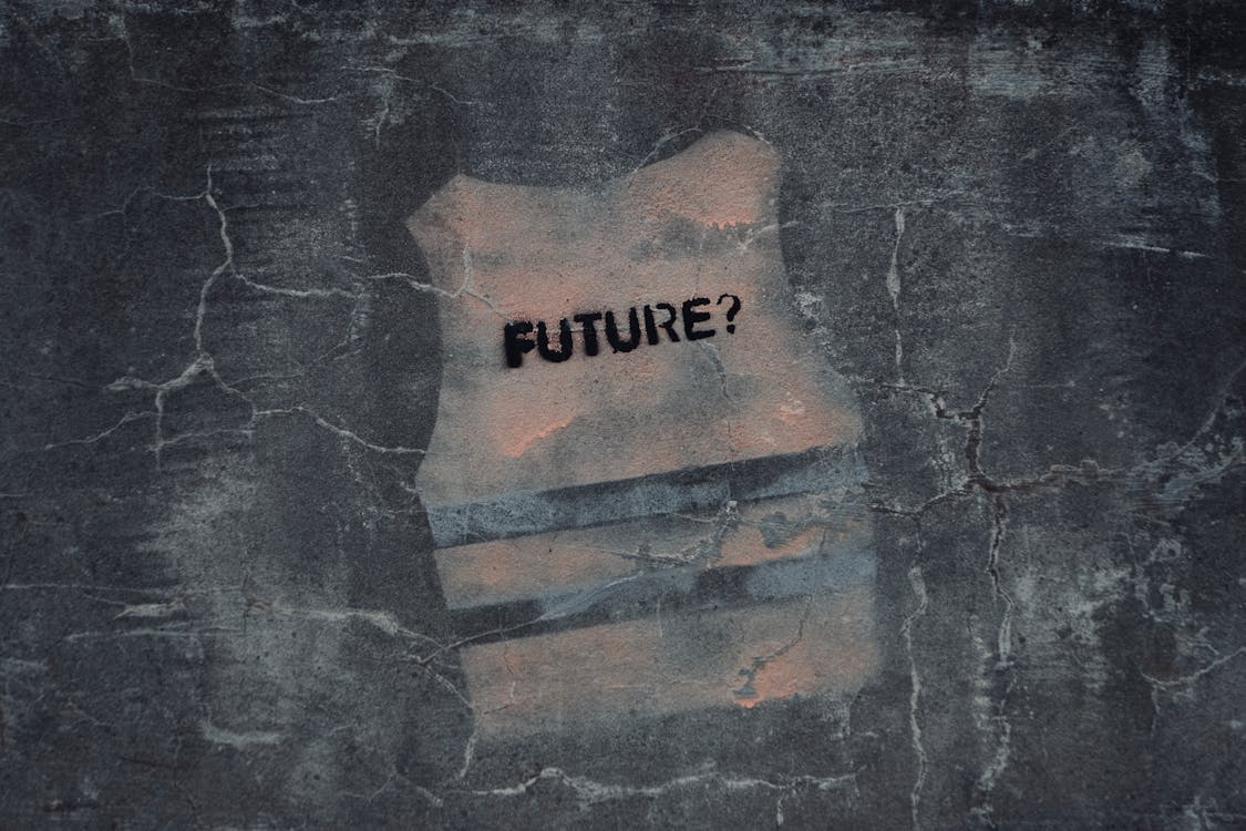 Graffiti of a vest on a wall with the word "FUTURE?" written.