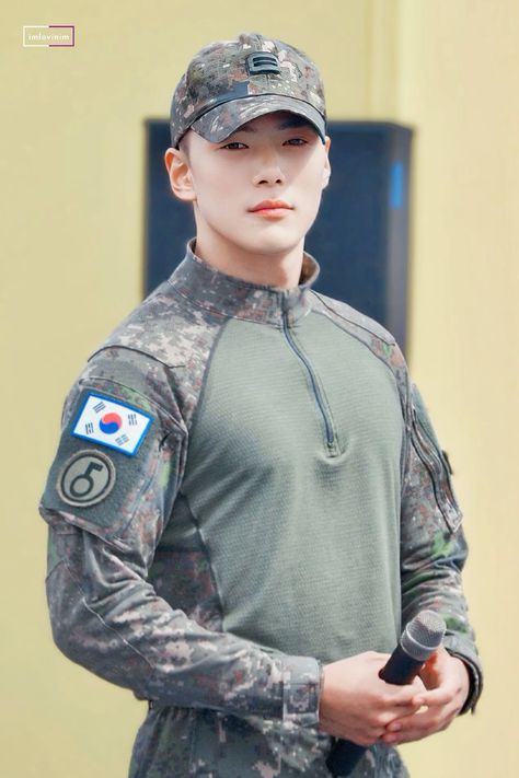 This contains an image of: Minhyuk on his army uniform