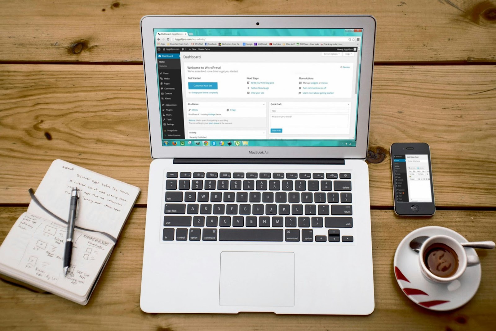 Image of laptop and a phone: WordPress ai builder automatic content
