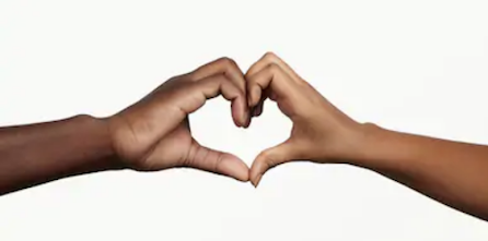 [Image: two hands reach to touch one another, with fingers curled to create a heart shape. The hand on the left is dark skinned; the hand on the right is medium skin tone.]