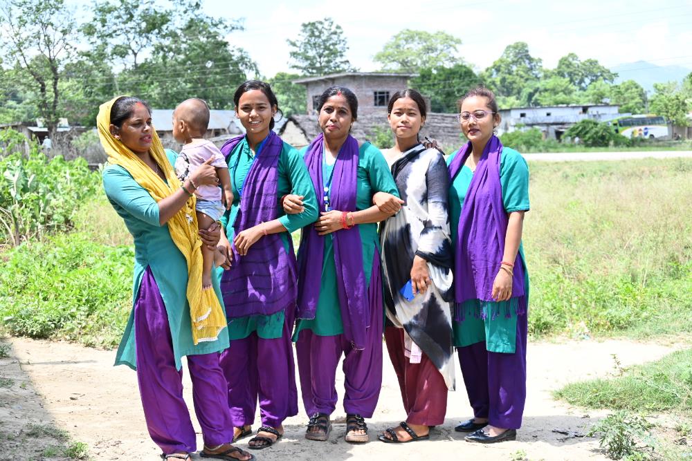 A group of people posing for a photo</p>
<p>Description automatically generated with medium confidence