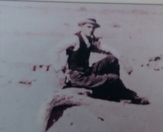 Howard sitting on a mammoth tusk