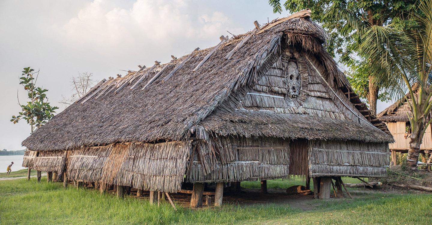 A building with grass roof<br /><br />Description automatically generated