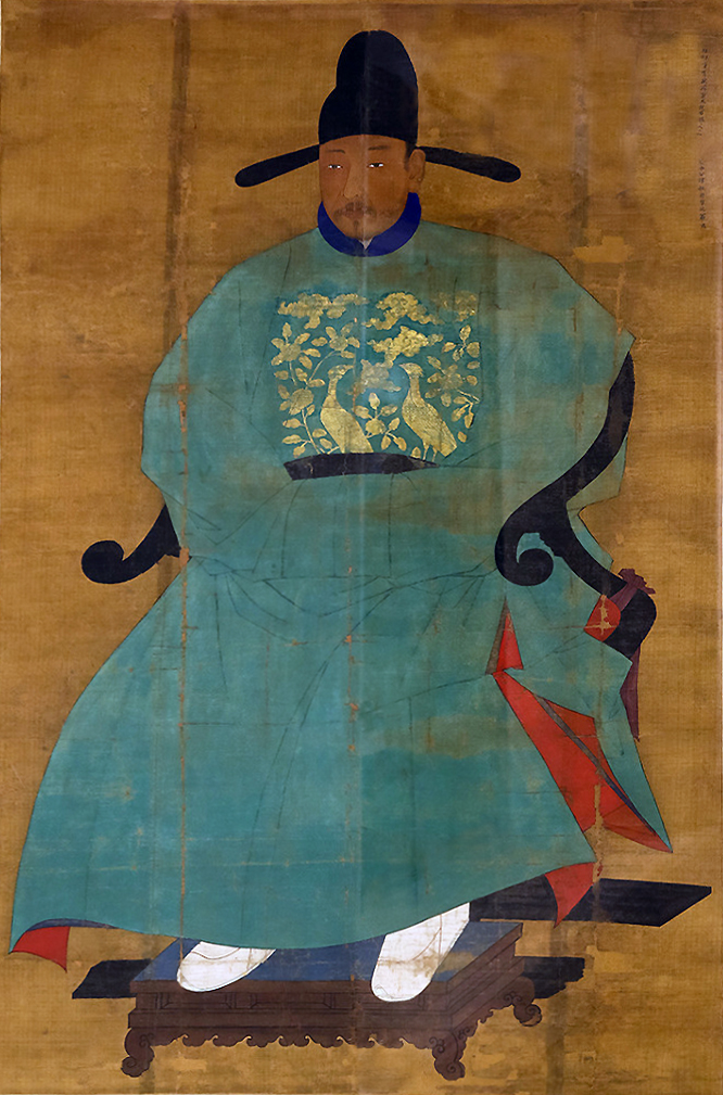 Painting. A seated man wearing a voluminous, teal robe and a black hat with two flaps on each side, gold background.
The subject of this portrait is seated in a chair that his robe covers. The teal robe has a gold-colored decoration on the chest area, portraying two peacocks and a floral design. His feet are propped on a foot rest and encased in white fabric.

