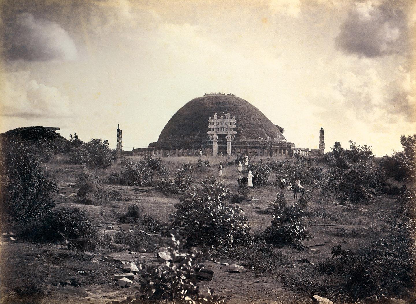 A large dome shaped building with people walking around<br /><br />Description automatically generated with medium confidence