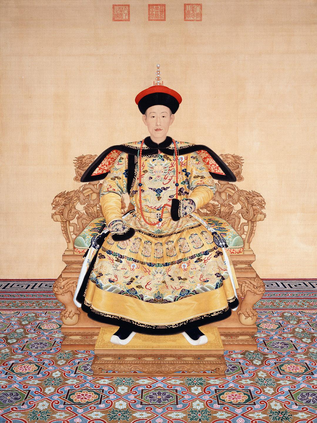 A person in a traditional garment sitting on a chair

Description automatically generated