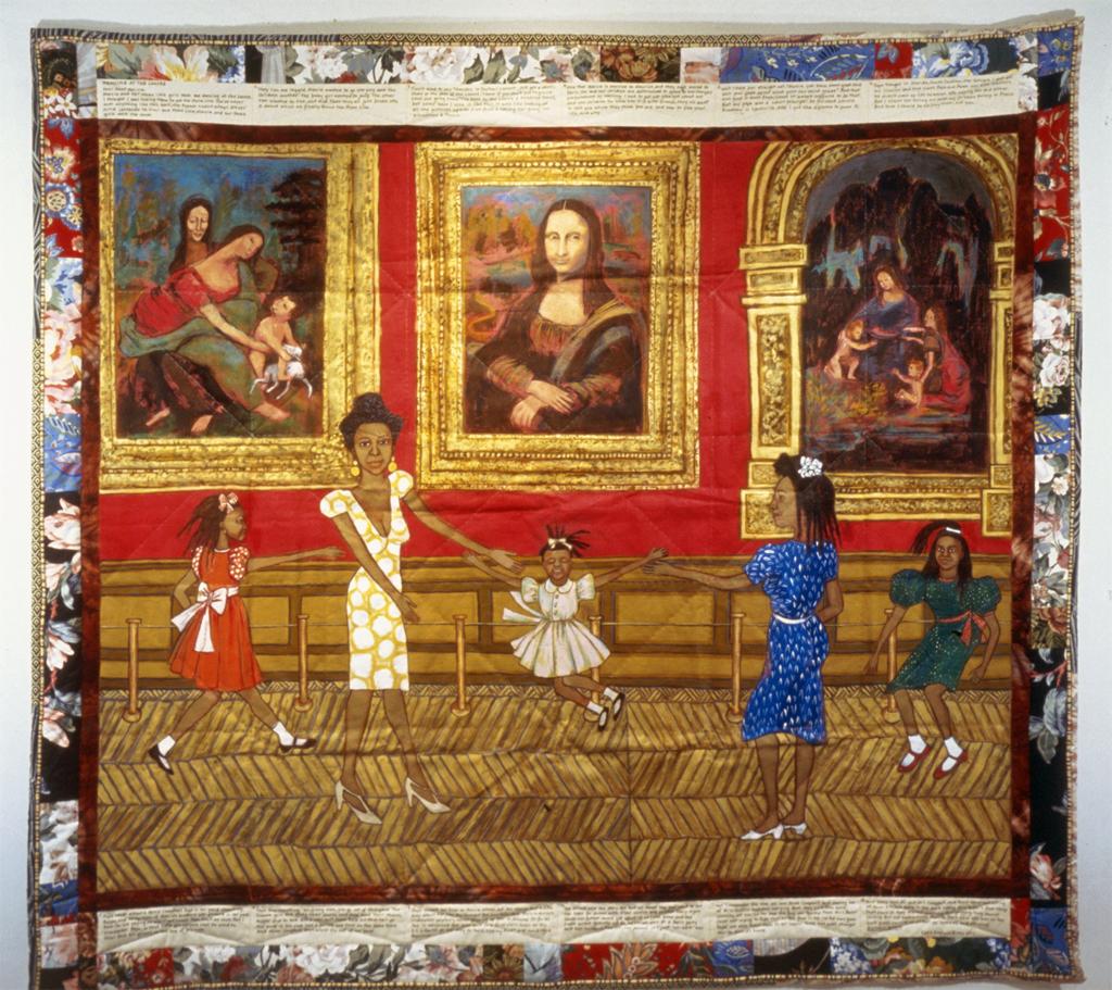 Quilt. A pictorial quilt depicts five female figures, dancing in front of famous paintings, the Mona Lisa in the center.
This large, colorful quilt contains both fabric and painted canvas, sewn together to give the appearance of a continuous textile. The quilt is bordered with intricate, colorful patterns on all four sides. Inside this outer border, at the top and bottom, are two strips of off-white fabric that contain passages of writing, in six segments each. The space inside the border is divided into two horizontal sections, one with a flat red background and one with a floor pattern in browns and golds. The red panel contains a three-part composition, with a representation of Leonardo da Vinci's "Mona Lisa" in the middle, flanked by "The Virgin Child and Saint Anne" on the left, and "Madonna of the Rocks" on the right. All three paintings are framed by thick, gold, fabric borders. In the foreground there are five female figures, two adults and three children. Four of the figures are dancing joyously before the paintings, the two women swinging the smallest girl between them. The other dancing child reaches toward the nearest adult from the left, and the only figure who is not dancing sits off to the right, on a wooden bench. They all wear bright-colored, fancy dresses. The three girls wear bobby socks and dress shoes with straps, and the women wear elegant, white high heels.

