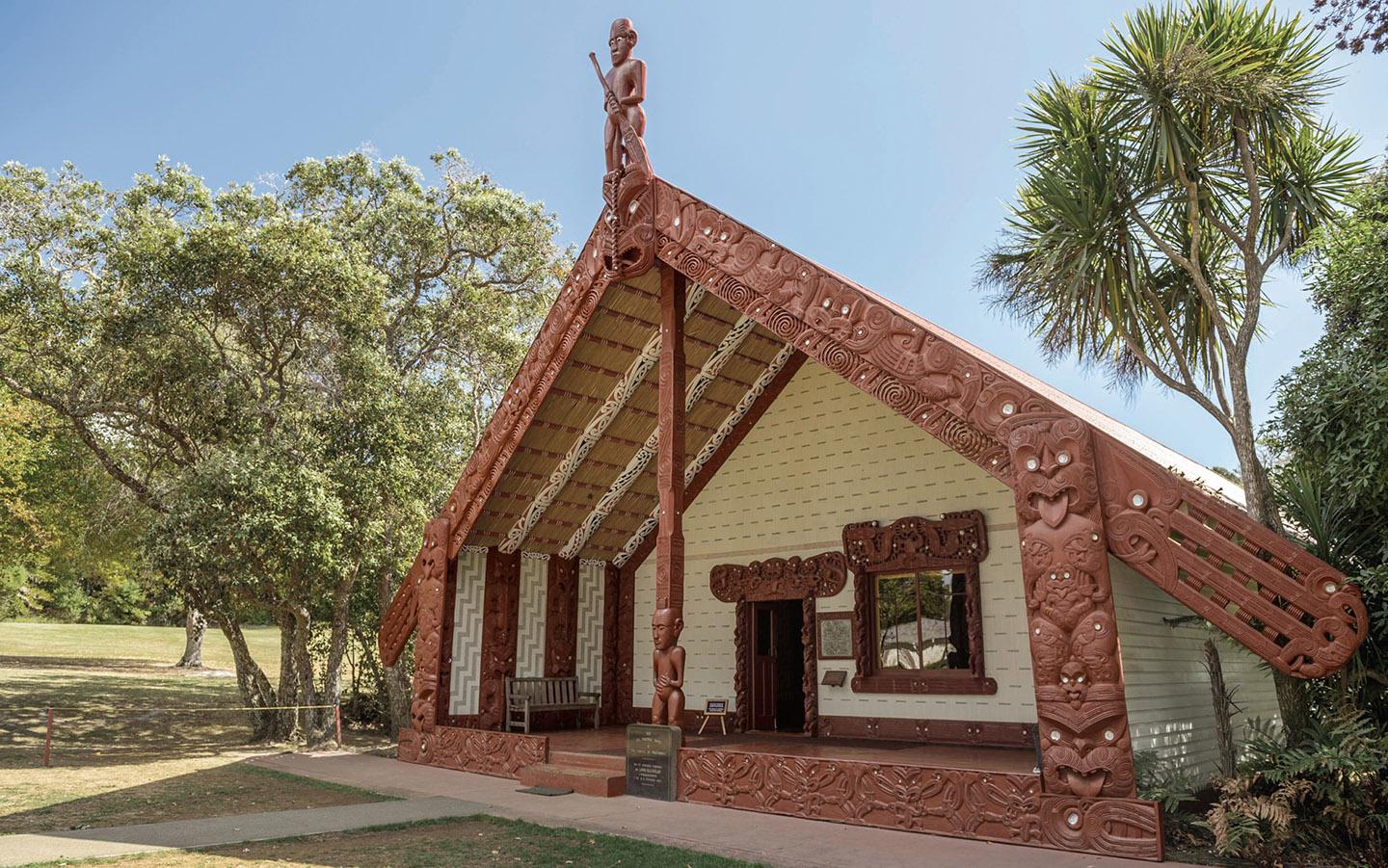 A building with a carved roof<br /><br />Description automatically generated