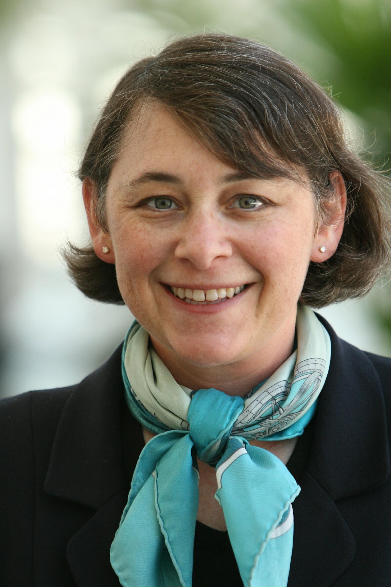 A person wearing a scarf and a black jacket AI-generated content may be incorrect.